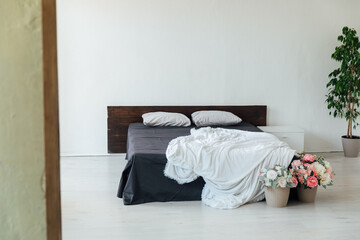 Fototapeta na wymiar interior of white bedroom bed with flowers room