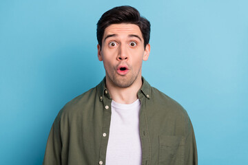 Portrait of impressed guy look open mouth amazing message isolated over sky light color background