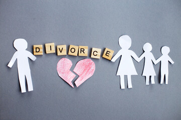 Paper chain cut family with broken heart on gray background. Divorce and broken family concept