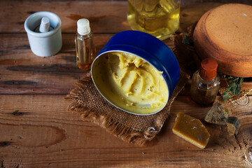 homemade bee wax and oil based salve and traditional natural ingredients for it preparation