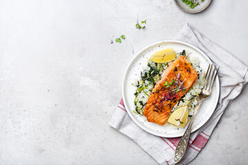 salmon steak with lemon rice and spinach