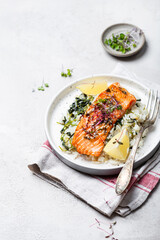 salmon steak with lemon rice and spinach