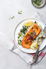 salmon steak with lemon rice and spinach