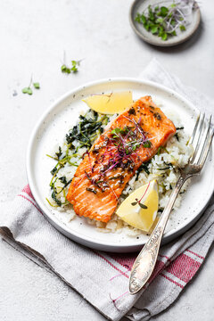 salmon steak with lemon rice and spinach