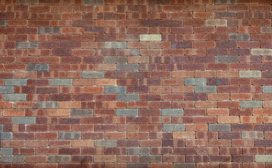 Brown brick wall texture. Urban background, horizontal format.