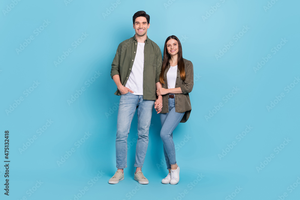 Sticker Full length photo of affectionate soulmate lady hold hand guy cuddle date wear denim jeans isolated over blue color background