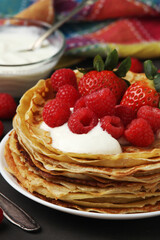 Russian cuisine national dish bliny with fresh berries	