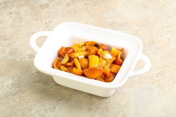 Marinated pickled honey mushrooms in the bowl