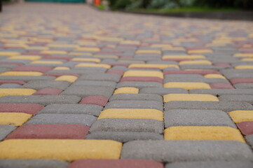 Paving slabs, clinker paving stones. Yellow-red and gray paving slabs. The background is made of...