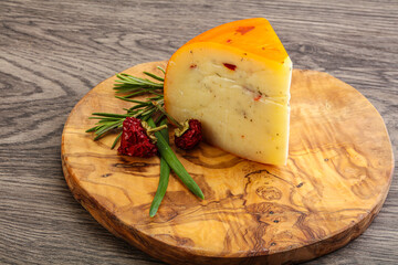 Hard cheese with dry tomato