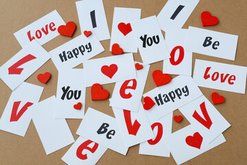 Notes with  text "Love" "I love you" "Be Happy" red hearts. Valentine day`s card, background. 14 feb