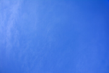 Background of blue sky and barely noticeable clouds and fog