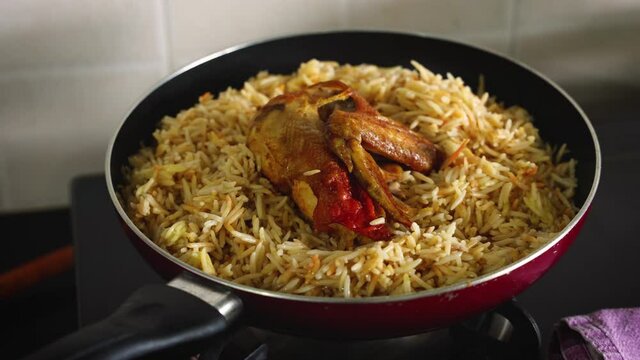 Arabic chicken Manthi mandi cooked meat Basmati rice with Masala spice woman hand serving cooking Kuzhimanthi hot spicy Manthi 4K video footage Malabar Kerala South India Indian non veg food Sri Lanka