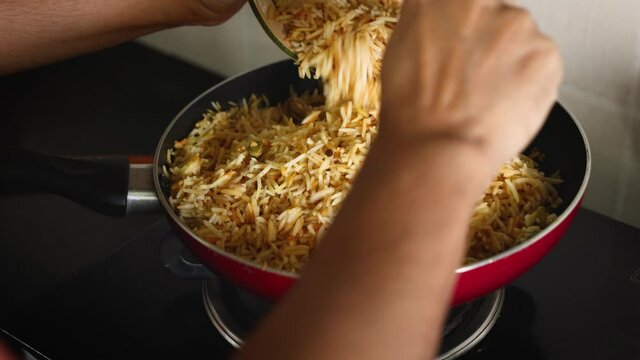 Arabic chicken Manthi mandi cooked meat Basmati rice with Masala spice woman hand serving cooking Kuzhimanthi hot spicy Manthi 4K video footage Malabar Kerala South India Indian non veg food Sri Lanka