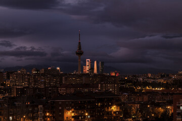 Naklejka premium Panorama of city of Madrid, Spain, at night, with high tower buildings on background
