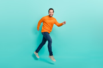 Full size profile photo of cheerful excited man toothy smile look camera isolated on turquoise color background
