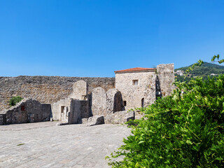 Fototapeta na wymiar The view of Budva medieval fortress of St. Mary, Citadel, landscape of Old town Budva, Montenegro: ancient walls, beautiful Landscape.