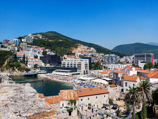 Fototapeta na wymiar Panoramic cityscape of The Old Town of Budva, Montenegro, beautiful top view of Adriatic Sea and the Balkan Mountains