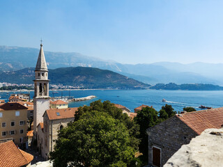 Naklejka na ściany i meble Panoramic cityscape of The Old Town of Budva, Montenegro, beautiful top view of Adriatic Sea and the Balkan Mountains
