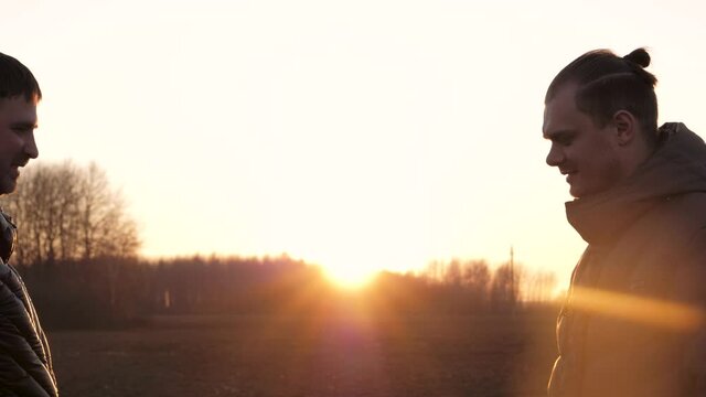 Elbow To Elbow Touching Greeting Two Men On Street Keeping Social Distancing.