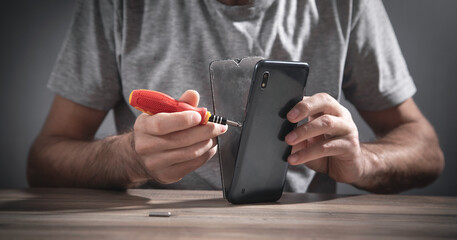 Technician repairing smartphone. Repair service