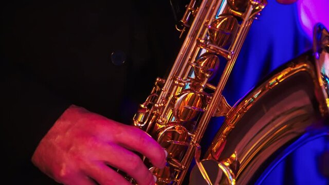 Saxophonist play on golden saxophone. Music. Live performance. . High quality 4k footage