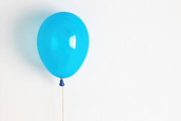 Blue balloon. A blue festive, joyful balloon on a string. 