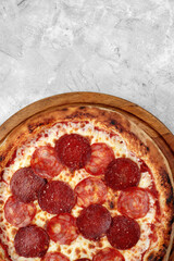 Homemade cheese pizza with salami, delicious pizza with cheddar. pepperoni pizza