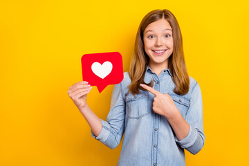 Photo of impressed little blond girl index like wear jeans cloth isolated on vivid yellow color background