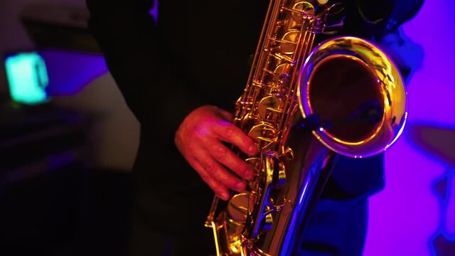 Saxophonist play on golden saxophone. Music. Live performance. . High quality 4k footage