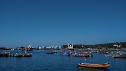 Fototapeta na wymiar Fishing boats in vizhinjam harbor, Thiruvananthapuram, Kerala, seascape view