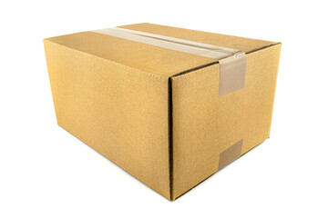Closed rectangular cardboard box made of corrugated cardboard, sealed with gray tape, isolated on a white background.