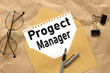 project manager. text on a white sheet of paper on an envelope