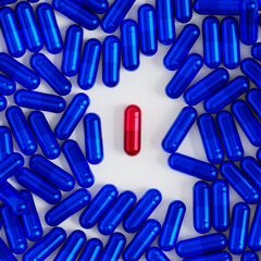 Blue and red capsule pills on white background, healthcare medical concept, antibiotics and cure, 3d render