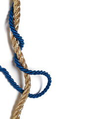 golden rope woven with blue silk rope - christmas concept background

