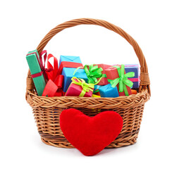 Fototapeta na wymiar Gifts in the basket with heart.