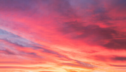 Sunset with a colorful sky in orange, yellow, purple and pink, Horizon twilight in the evening with a beautiful dusk sky sunlight in Winter at countryside,Image Nature for Holiday banner background
