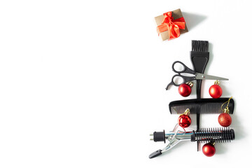 Christmas hairdresser composition with combs, brush, scissors, tools and accessories with new year decorations on white background. Stylish concept. Flat lay, top view with copy space
