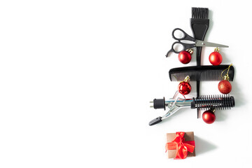 Christmas hairdresser composition with combs, brush, scissors, tools and accessories with new year decorations on white background. Stylish concept. Flat lay, top view with copy space