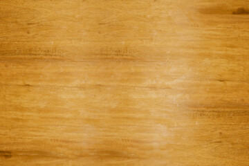Smooth textured yellow wooden board close up top view for background