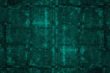 Aged dark cyan concrete wall with abstract pattern and heavy grunge texture for background