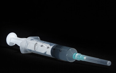 COVID-19 coronavirus vaccine and injection syringe