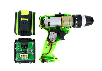 Inside the mechanism of a cordless drill and battery  on a white background.