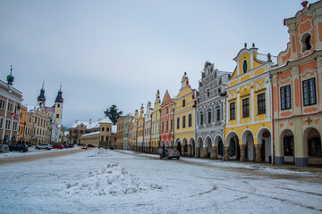 Fototapeta na wymiar Square in old Telc town in winter dark cold morning