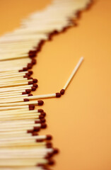 pile of matchstick on yellow background