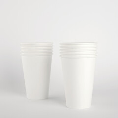 White paper disposable cups isolated on white background. Free space for your brand