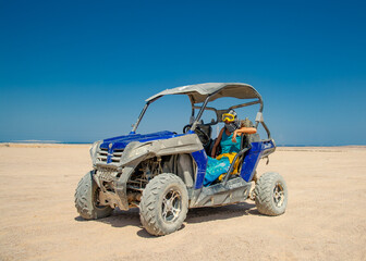 Female driving Atv in desert Egypt Hurgada