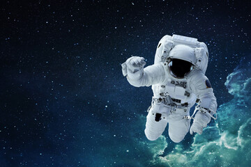 Spaceman astronaut with hamlet flying in blue deep space with stars.