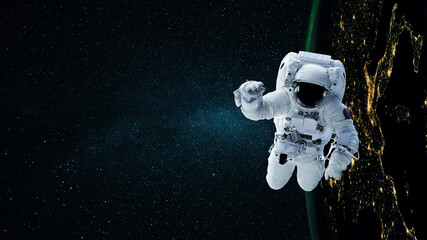 Space man astronaut flying in space with stars and night planet earth.
