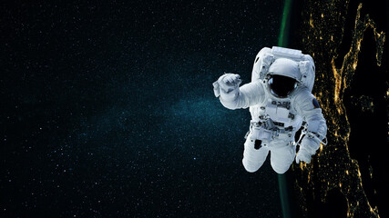 Space man astronaut flying in space with stars and night planet earth. © alones